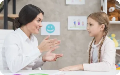 smiling portrait girl female psychologist having conversation office