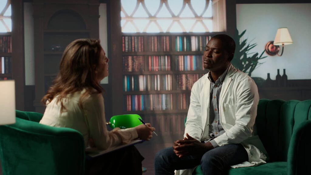 african american doctor surgeon sharing his ptsd issues with psychiatrist