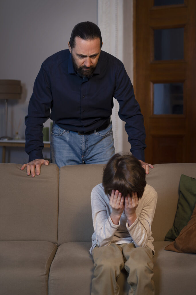 young child suffering from abuse by parent home